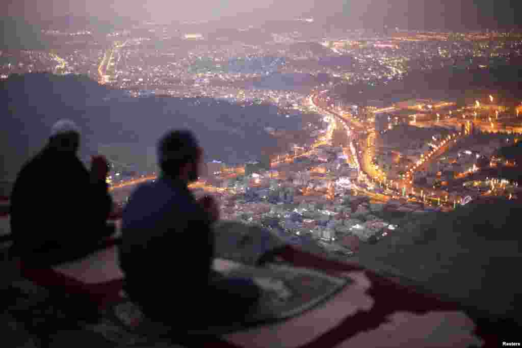 Muslim pilgrims pray atop Mount Thor in the holy city of Mecca, Saudi Arabia, ahead of the annual Hajj pilgrimage, Oct. 11, 2013.