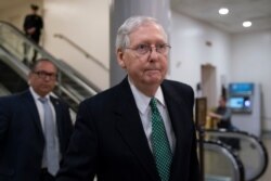 FILE - Senate Majority Leader Mitch McConnell, R-Ky., heads to a briefing Jan. 8, 2020, on Capitol Hill in Washington.