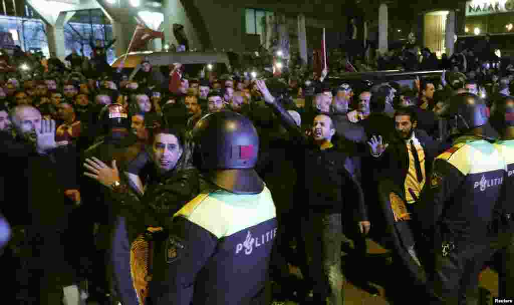Police start to remove demonstrators outside the Turkish consulate in Rotterdam, Netherlands, March 11, 2017.