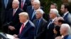 FILE - President Donald Trump with Vice President Mike Pence, left, and members of the president's coronavirus task force speaks during a news conference at the Brady press briefing room of the White House, Feb. 26, 2020, in Washington.