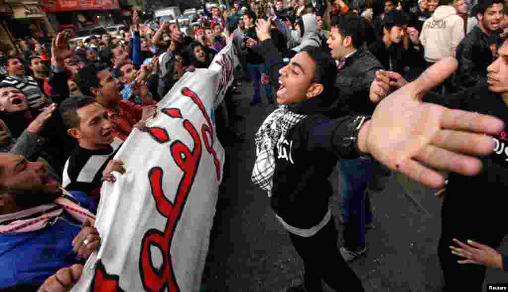 Protesters take part in a march during the second anniversary of the resignation of Hosni Mubarak, at Tahrir Square in Cairo, February 11, 2013.