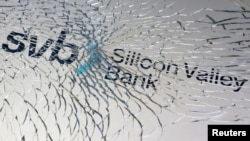 FILE - SVB (Silicon Valley Bank) logo is seen through broken glass in this illustration taken March 10, 2023.