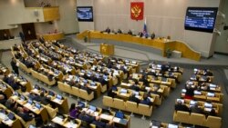 FILE - Lawmakers are seen in session in the State Duma, the lower house of the Russian Parliament in Moscow, Russia, Sept. 27, 2018.