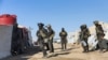 Pripadnici snaga Kurdske narodne zaštitne jedinice u Siriji (YPG) izvode bezbjednosnu operaciju u kampu Al Hol, pod kurdskom kontrolom, 28. marta 2021. (AFP PHOTO/HO/YPG)