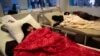 FILE - Women are treated for a suspected cholera infection at a hospital in Sanaa, Yemen, May 15, 2017.