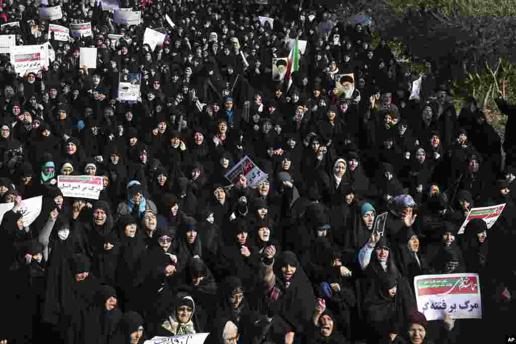 Iranian protesters chant slogans at a rally in Tehran, Iran, Dec. 30, 2017. Iranian hard-liners rallied Saturday to support the country's supreme leader and clerically overseen government as spontaneous protests sparked by anger over the country's ailing economy roiled major cities in the Islamic Republic.