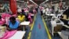 FILE - Employees work on the manufacturing line at the United Aryan Export Processing Zone textile factory in Nairobi, Kenya April 13, 2017. Boosted by clothing sales, the U.S. is now the nation that buys the most Kenyan goods. 