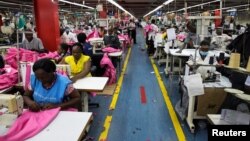 FILE - Employees work on the manufacturing line at the United Aryan Export Processing Zone textile factory in Nairobi, Kenya April 13, 2017. Boosted by clothing sales, the U.S. is now the nation that buys the most Kenyan goods. 