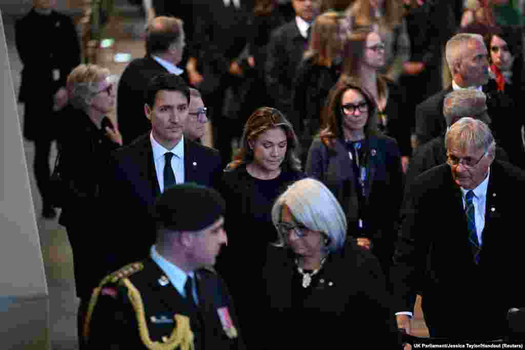 Canada's Prime Minister Justin Trudeau and his wife Sophie Trudeau pay respects to Queen Elizabeth as she lies in state in Westminster Hall in London, Sept. 17, 2022.