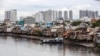 (FILES) Rumah-rumah di tepi kanal Te di Kota Ho Chi Minh, 17 September 2018. (Kao NGUYEN / AFP)