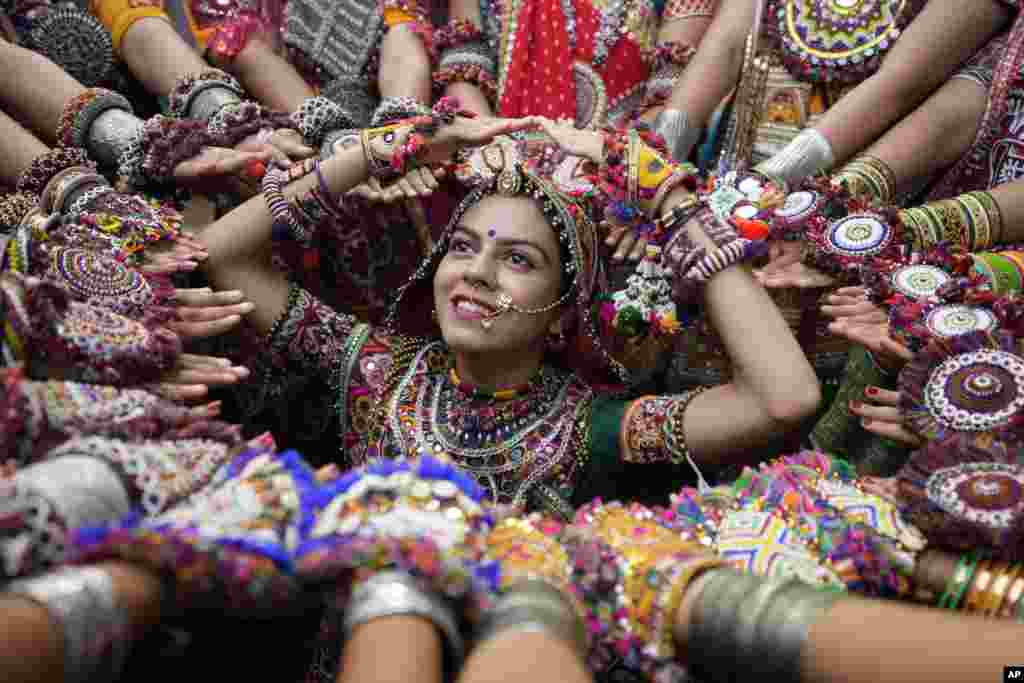 Women wearing traditional attire practice the Garba, the traditional dance of Gujarat state, ahead of Navratri in Ahmedabad, India.