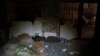 Duvets and sleeping bag are seen in a basement which, according to Ukrainian authorities, was used as a torture cell during the Russian occupation, in the retaken village of Kozacha Lopan, Ukraine, Sept. 17, 2022. 
