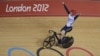 Britain's Jason Kenny celebrates after winning the gold medal in the track cycling men's sprint event, during the 2012 Summer Olympics in London, Monday, Aug. 6, 2012.