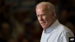 FILE - Former vice president Joe Biden speaks during a campaign event for Kentucky democratic congressional candidate Amy McGrath in Owingsville, Kentucky, Oct. 12, 2018.