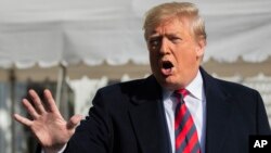President Donald Trump talks to the media before leaving the White House, Nov. 9, 2019, in Washington. 