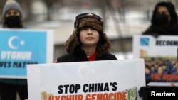 Umer Jan, 12, takes part in a rally to encourage Canada and other countries to consider labeling China's treatment of its Uighur population and Muslim minorities as genocide, outside the Canadian Embassy in Washington, D.C., Feb. 19, 2021.