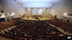 Iraqi lawmakers attend a session of parliament in Baghdad (file photo)