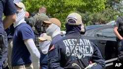 Authorities arrest members of the white supremacist group Patriot Front near an Idaho pride event, June 11, 2022.
