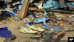 Shattered remnants are seen at the site of a bomb blast at a bar in the Nigerian northeastern city of Maiduguri. An explosion killed at least five people and injured 10 more on Sunday at a bar near a police barracks in Nigeria's northeastern city of Maidu
