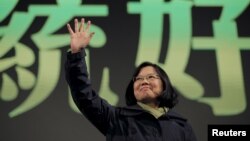 Democratic Progressive Party (DPP) Chairperson and presidential candidate Tsai Ing-wen waves to her supporters after her election victory at party headquarters in Taipei, Taiwan, Jan. 16, 2016. 