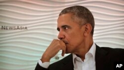 FILE - Former U.S. President Barack Obama listens to a question during a leadership summit in New Delhi, India, Dec. 1, 2017. 