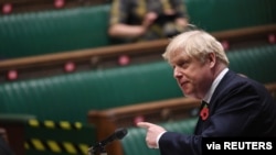 Britain's Prime Minister Boris Johnson speaks during the weekly question-time debate at the House of Commons in London, Britain, Nov. 11, 2020. 