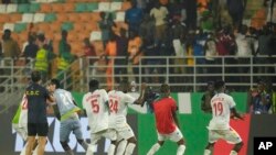 Jogadores da República Democrática do Congo festejam no Estádio Amadou Gon Coulibaly, em Korhogo, Costa do Marfim, 24 jan 2024