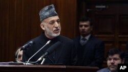 FILE - Afghan President Hamid Karzai is shown during his final address to parliament in Kabul, March 15, 2014.