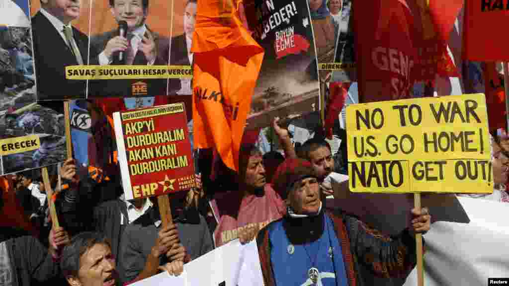 Protesters demonstrate in front of the Turkish Parliament in Ankara, Oct. 2, 2014.