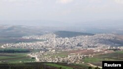 FILE - A general view shows the Kurdish city of Afrin, in Aleppo's countryside, March 18, 2015.