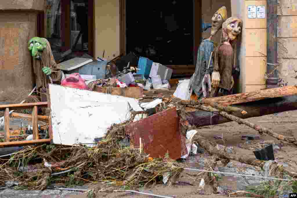 Debris is scattered next to a damaged building following the floods from Storm Boris, in Ladek-Zdroj, southern Poland.
