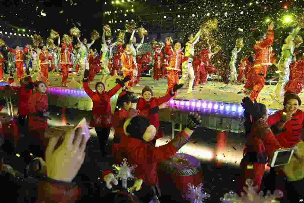 Participants of a count down to the New Year event marking the passage into 2018 in Beijing, China, Jan. 1, 2018.