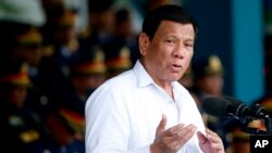 FILE - Philippine President Rodrigo Duterte gestures during a speech at Camp Crame in Quezon city, northeast of Manila, Aug. 8, 2018.