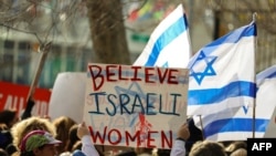 FILE - Demonstrators gather outside U.N. headquarters in New York, Dec. 4, 2023. Israeli women and legal activists criticized international rights groups' response to reports of alleged sex crimes committed by Hamas militants during the October 7 attacks.