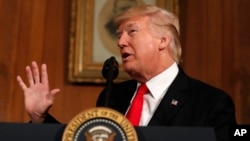 FILE - President Donald Trump speaks at the Interior Department in Washington, April, 26, 2017.