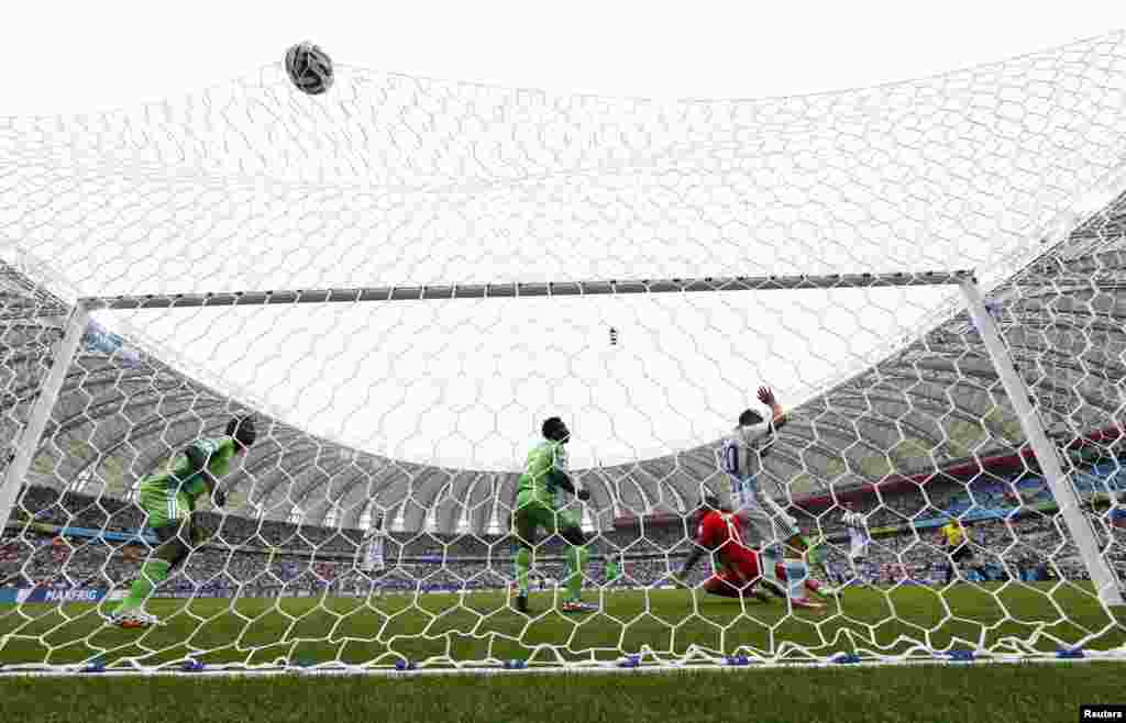 Argentinian Lionel Messi scores a goal against Nigeria at the Beira Rio stadium in Porto Alegre, June 25, 2014.