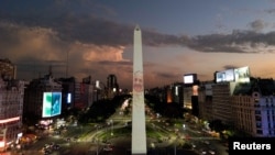 A drone view shows an image of Pope Francis displayed with a digital video-mapping at the Obelisco as the worlds pray for the pontiff’s health, in Buenos Aires, Argentina, Feb. 21, 2025.