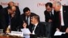 Egyptian President Mohamed Morsi (C) chatting with officials during the closing session of the 12th summit of the Organization of Islamic Cooperation (OIC) in Cairo, February 7, 2013.