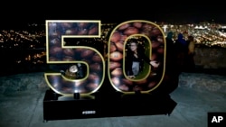 Erika Moya, left, and Ashley King, pose for a photo in a Super Bowl 50 at a park overlooking San Francisco Wednesday, Feb. 3, 2016. The Denver Broncos play the Carolina Panthers in the NFL Super Bowl 50 football game Sunday, Feb. 7, 2015, in Santa Clara, 