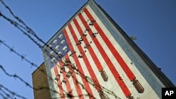 An anti-U.S. mural is seen on a wall of a government building in central Tehran, Iran, October 12, 2011.