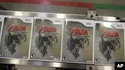 FILE - Boxes of the game 'Legend of Zelda' made for Nintendo's latest game console, Wii, sit on a conveyer at the North American distribution center in North Bend, Wash., Nov. 8, 2006. 