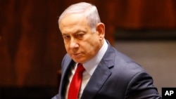 Israeli Prime Minister Benjamin Netanyahu before voting in the Knesset, Israel's parliament in Jerusalem, Wednesday, May 29, 2019. (AP Photo/Sebastian Scheiner)