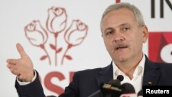 FILE - Leader of Romania's leftist Social Democrat Party (PSD), Liviu Dragnea, gestures during a press conference following the end of the parliamentary elections, in Bucharest, Romania, Dec. 11, 2016.