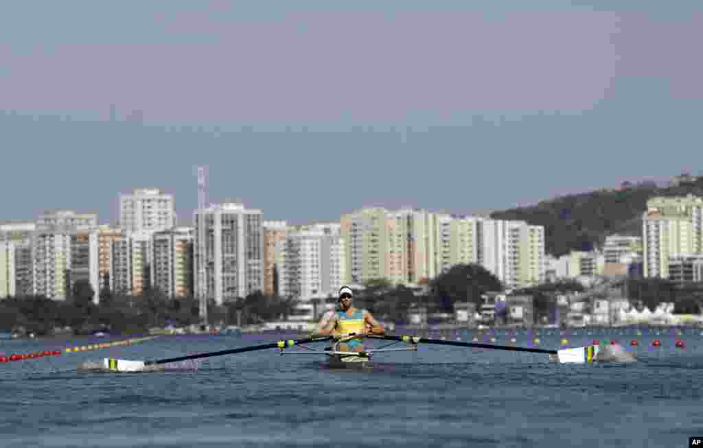 Spencer Turrin and Alexander Lloyd, of Australia, compete in a men's pair heat in Lagoa during the 2016 Summer Olympics in Rio de Janeiro, Brazil, Aug. 6, 2016.