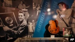FILE - An 'Elvis' exhibit is seen inside an annex at Graceland in Memphis, Tennessee.