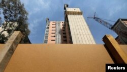 A building being demolished is seen five months after a Sept. 19, 2017, earthquake, in the Colonia Doctores neighborhood in Mexico City, Mexico, Feb. 7, 2018.