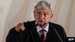 FILE - Mexico's President Andres Manuel Lopez Obrador presents the new economic program for the northern border zone, in Tijuana, Baja California State, Mexico, Jan. 6, 2019.