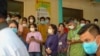 Cambodian onlookers watch Prime Minister Hun Sen gets the AstraZeneca COVID-19 shot at Calmette Hospital, in Phnom Penh, Cambodia, March 4, 2021. (Khan Sokummono/VOA Khmer) 