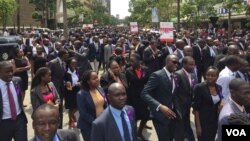 Kenyan lawyers march through streets of Nairobi to protest the alleged extrajudicial killing by police of their colleague, Willie Kimani, his client and their taxi driver, July 6, 2016. (J. Craig/VOA)