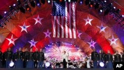 Keith Lockhart, center, conducts The Boston Pops orchestra during rehearsal for the annual Boston Pops Fireworks Spectacular on the Esplanade, July 3, 2017, in Boston, Massachusetts.